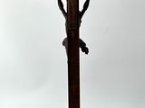 an image of a wooden cross with a bird on it and a bird on the cross