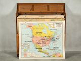 a wooden box with a map of the world inside of it