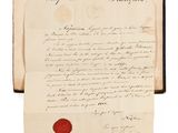 une feuille de papier sur laquelle est apposé un cachet de cire