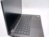 a laptop computer that is sitting on a white surface