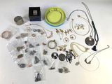 a lot of jewelry that is sitting on a table