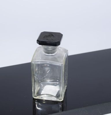 FLACON en verre avec bouchon orné du sigle de la ma…