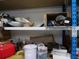 a shelf full of assorted items in a storage room