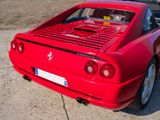 a red sports car parked on the side of the road