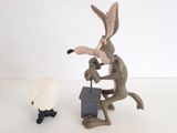 toy figurine of a rabbit and a sheep in front of a white background