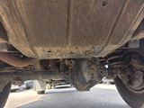 a close up of a vehicle ' s rear end with a tire