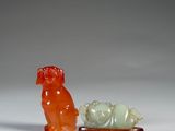 an image of a couple of figurines sitting next to each other on a table