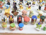 many different kinds of figurines displayed on a table