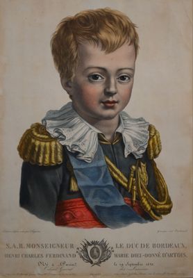 an old picture of a young boy wearing a uniform and holding a medal