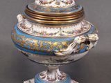 pair of blue and white porcelain urns with gold accents