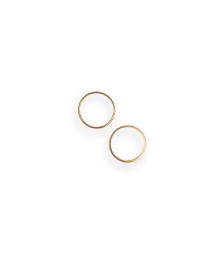 a pair of gold rings on a white background