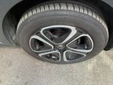 a close up of a tire on a car ' s rim
