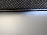 the back of a laptop computer sitting on top of a table