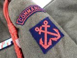 a close up of a uniform with an anchor on it