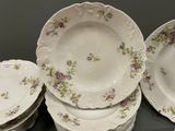 a lot of plates that are sitting on a table