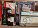 a cardboard box filled with books and other items