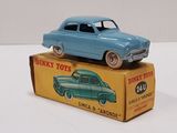 a blue toy car sitting on top of a box