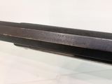 a gun that is on display on a table