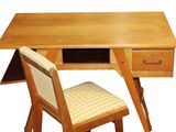 a small wooden desk with a chair underneath it