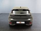 the rear end of a silver car in a white room