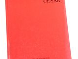 a red book sitting on top of a white table