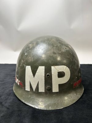 an army helmet with the word mp painted on it
