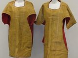 pair of mannequins with yellow and red dress on display