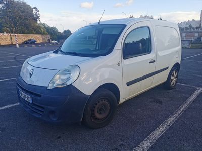a white van that is parked in a parking lot