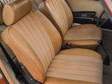 a brown car with tan leather seats in the back of it