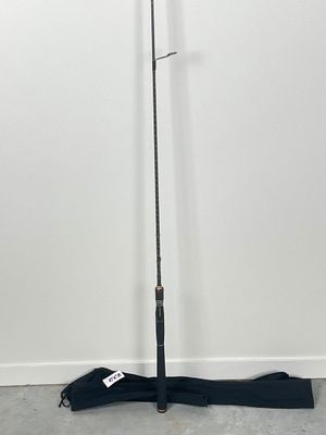 a close up of a pole with an umbrella on the ground