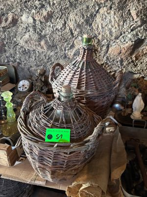 a wicker basket that has a green tag on it