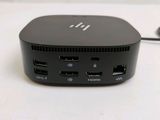 a close up of a small black device on a table
