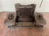 a small wooden box with a lid on a table