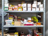 a shelving with many items on it in a room