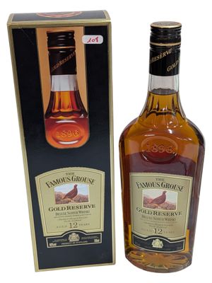an image of a bottle of whisky next to a box