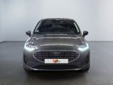 the front view of a grey ford monde parked in a showroom