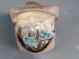 a small bag with some stuff in it on a table