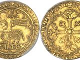 a gold coin with an image of a bird on it