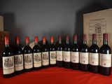 several bottles of red wine are lined up on a table
