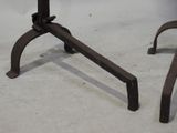 a pair of metal legs that are on a table