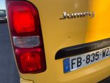 a close up of the rear end of a yellow car