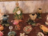 a lot of figurines that are sitting on a table