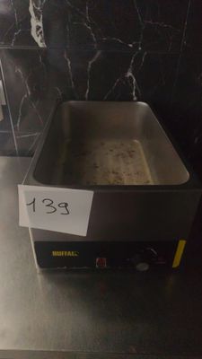 a frying pan sitting on a counter in a kitchen