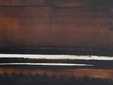 abstract painting of brown and white lines on a black background