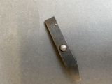 a knife that is laying on a table