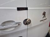 a close up of a door handle on a white van