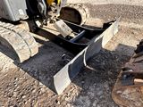 a picture of a bulldozer that is sitting in the dirt