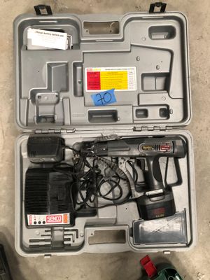 a tool in the case that is sitting on the floor