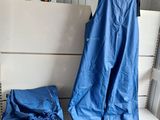 a mannequin and a pair of blue pants on a white table