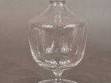 a clear glass vase sitting on a table